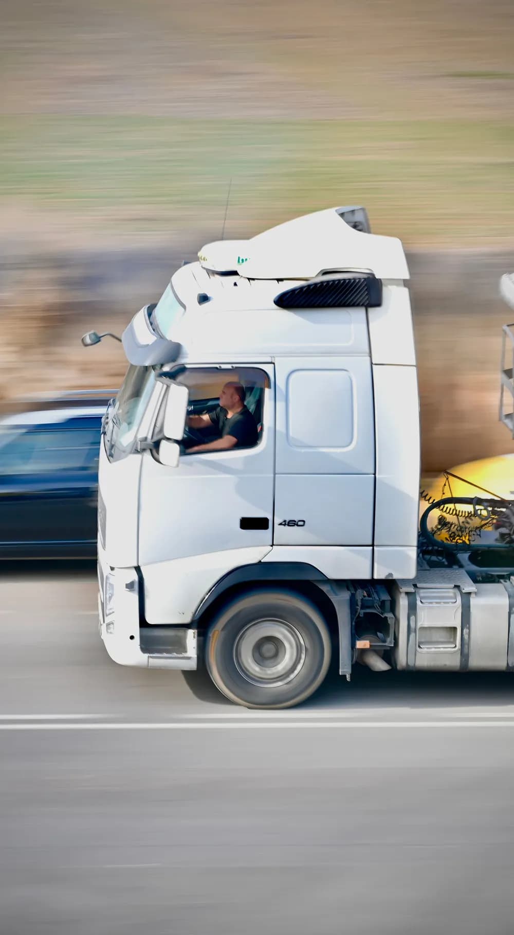 Truck on the highway, with transport emissions per shipment measured for CSRD reporting in alpha-TMS Truck on the highway, with transport emissions per shipment measured for CSRD reporting in alpha-TMS